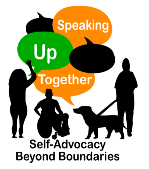 a group of 3 people - one with a wheelchair and another with a guide dog. 