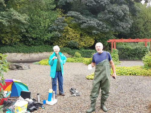 Two volunteers having a cuppa at the garden