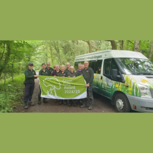 Countryside Volunteers with Green Flag and Countryside Minibus.