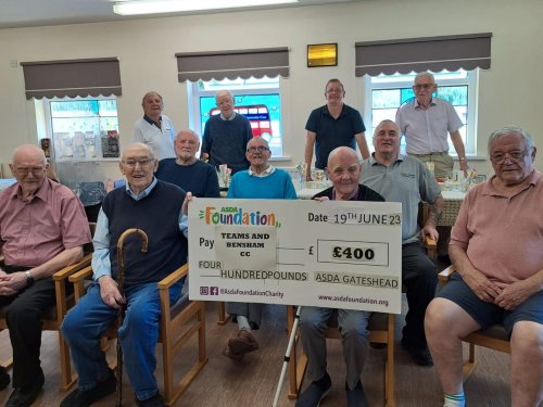 The Teams and Bensham Community Care men’s group, presented with a £400 cheque from the Asda Foundation