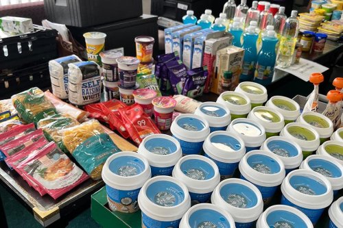 a photo of a range of food items , including cooking oil and bags of pasta