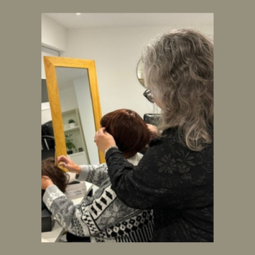 Image of a woman sorting her wig