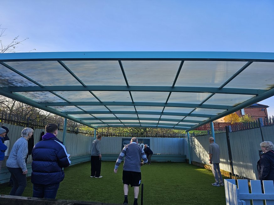 Over 50s playing cricket.