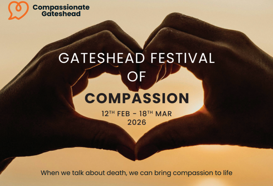 A photo of two hands forming a heart shape with a sunset behind them.