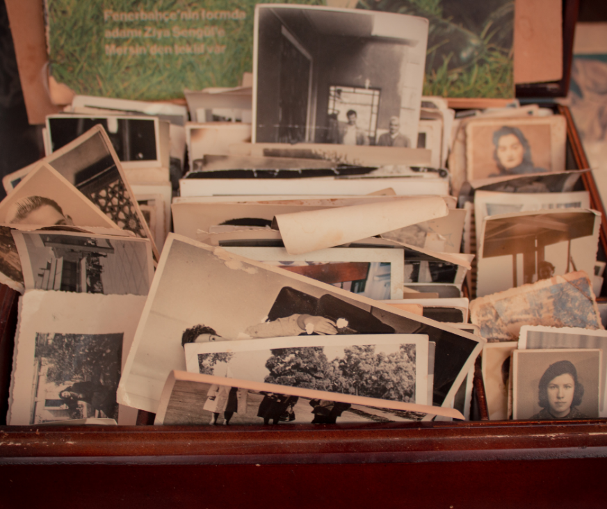 A photo showing a display of various old photos from different time periods.