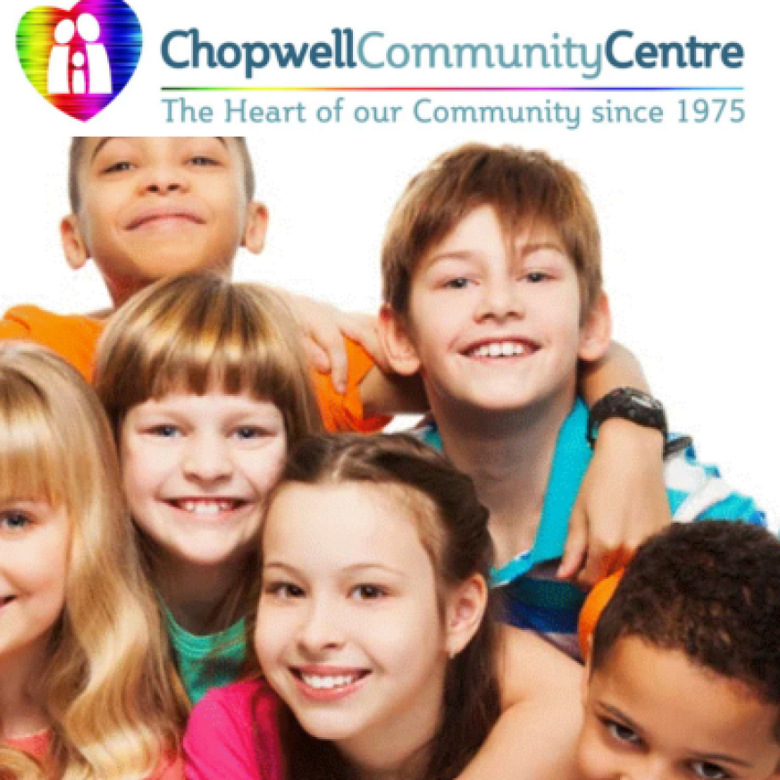 a photo of a group of smiling young people beneath the Chopwell community centre logo