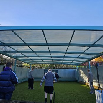 Over 50s playing cricket.