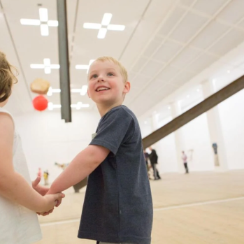 Children create art with parents 