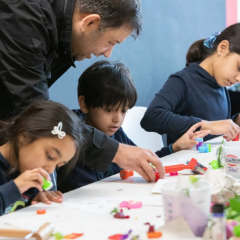 Children create art with parents 