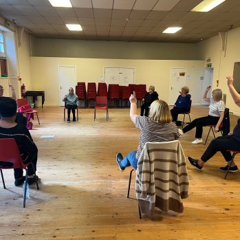 Clients doing chair exercises.