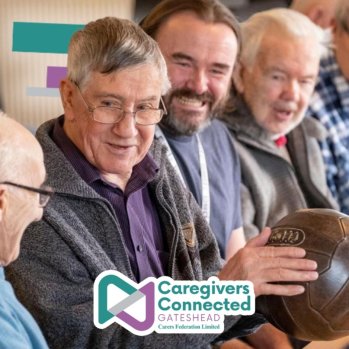 Group of poeple sharing stories while holding an leather football.