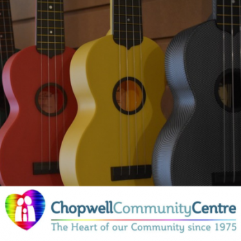 a row of colourful ukeleles 