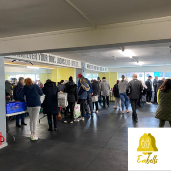 a photo of local residents attending the food market 