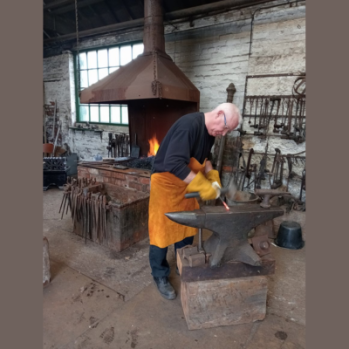man working at the forge