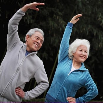 older couple stretching and exercising