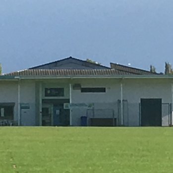 PICTURE OF SPORTS FIELD AND PAVILLION BUILDING