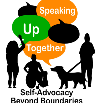 a group of 3 people - one with a wheelchair and another with a guide dog. 