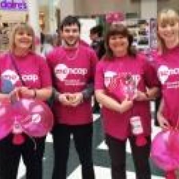 Group of volunteers in Pink T-shirts