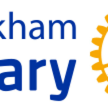 Whickham Rotary in blue text by a yellow rotary wheel.