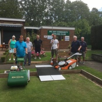 a photo of members of the gardening group standing outside the bowling club.