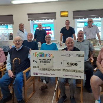 The Teams and Bensham Community Care men’s group, presented with a £400 cheque from the Asda Foundation