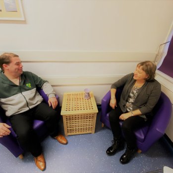 Staff talking in small meeting room